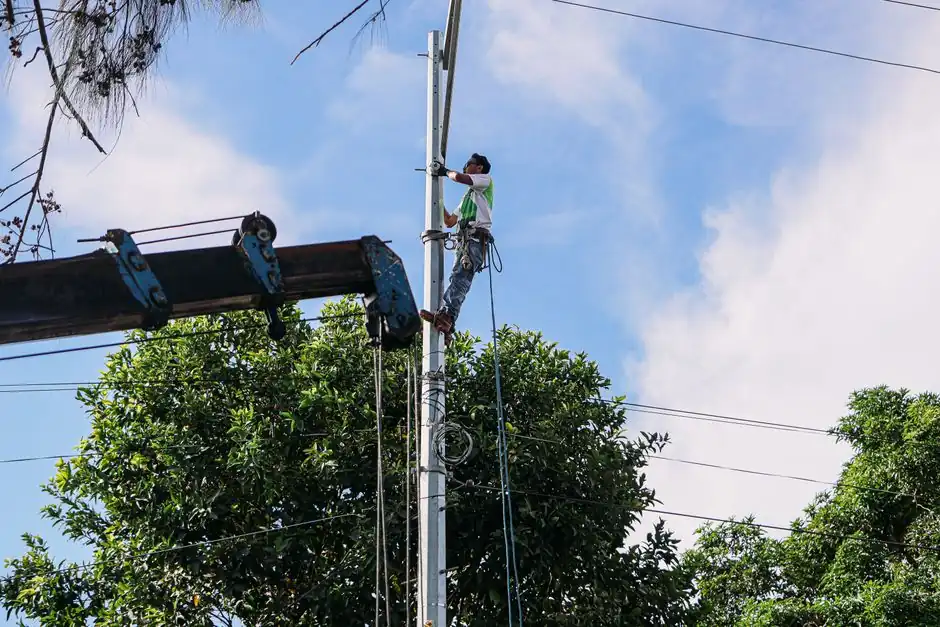 A utility technician at work on rural infrastructure near Hunter, New Braunfels, Texas.