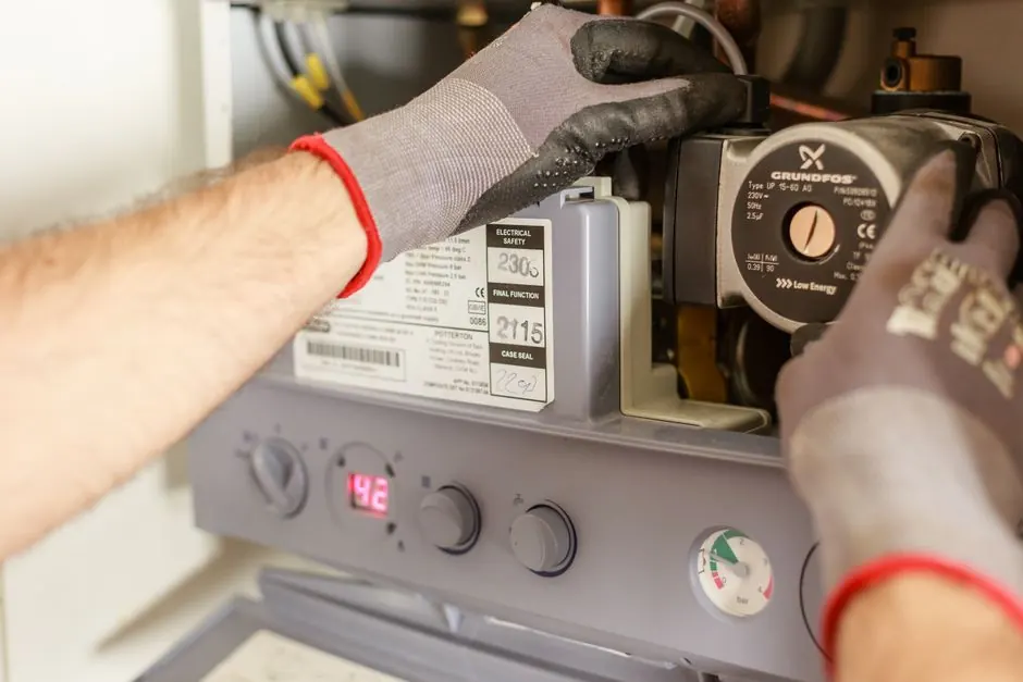 Technician performing pressure test on gas piping with gauges in New Braunfels TX